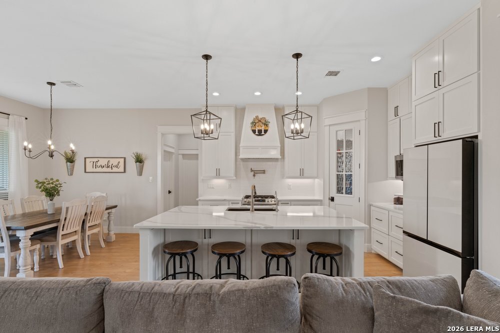 116 Park Heights Poth, TX 78147 - Photo 8 of 48 a view of kitchen with dining table and chairs