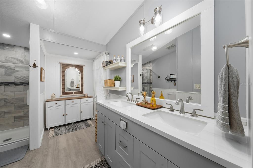 708 Fazzini Road Babson Park, FL 33827 - Photo 14 of 47 a bathroom with a double vanity sink mirror and double