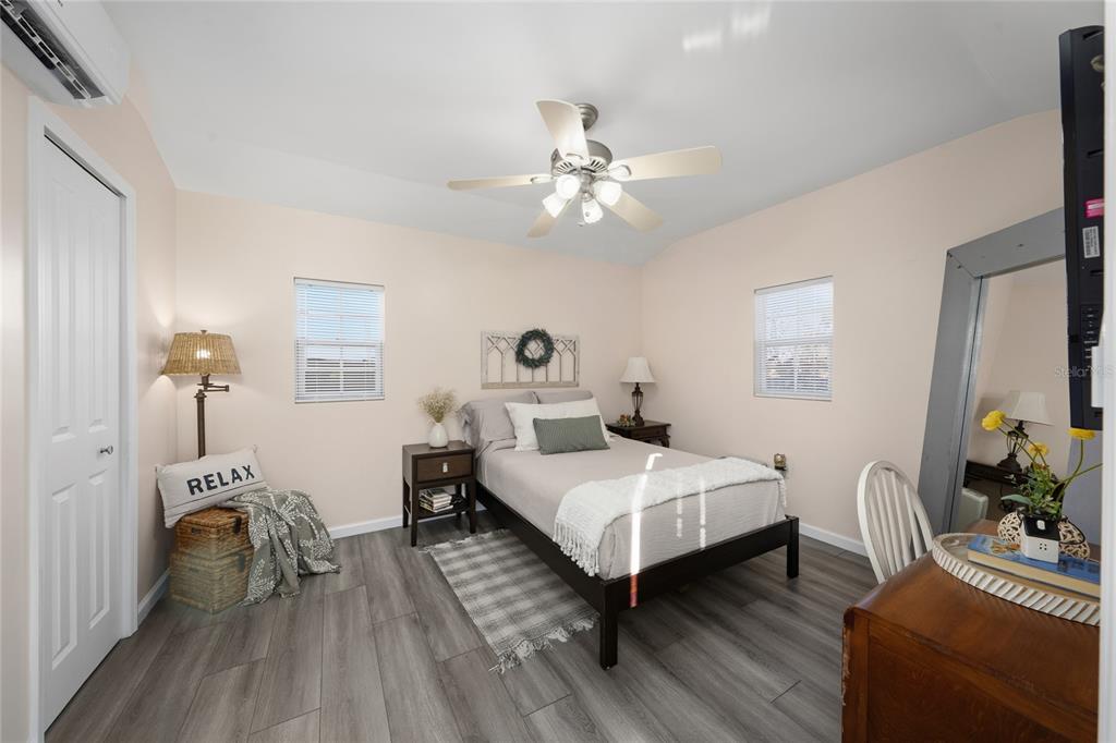 708 Fazzini Road Babson Park, FL 33827 - Photo 17 of 47 a bedroom with a bed and a chandelier