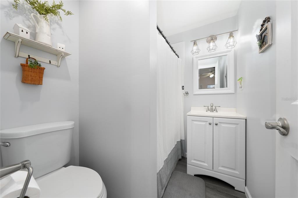 708 Fazzini Road Babson Park, FL 33827 - Photo 19 of 47 a bathroom with a toilet sink and mirror