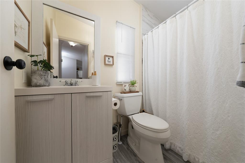 708 Fazzini Road Babson Park, FL 33827 - Photo 20 of 47 a bathroom with a toilet a sink and a mirror
