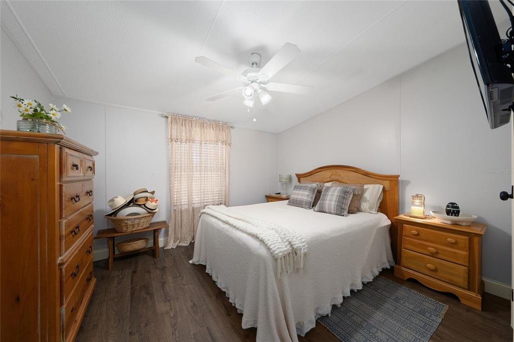 708 Fazzini Road Babson Park, FL 33827 - Photo 21 of 47 a bedroom with a bed and wooden floor