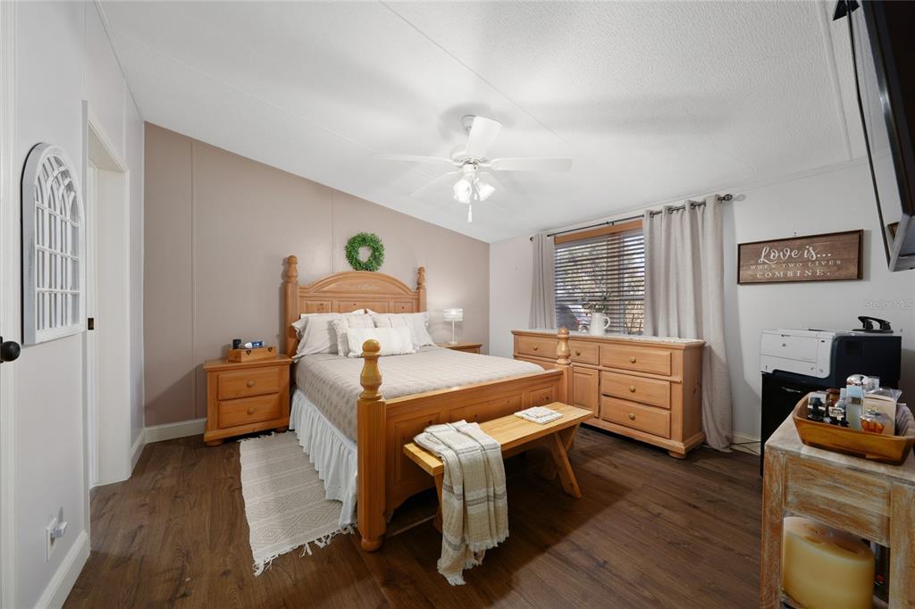 708 Fazzini Road Babson Park, FL 33827 - Photo 27 of 47 a bedroom with furniture and a wooden floor