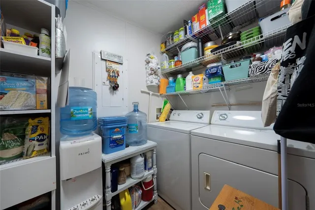 a view of a house with a wooden deck