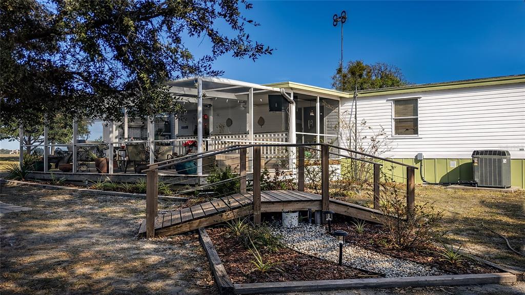 708 Fazzini Road Babson Park, FL 33827 - Photo 30 of 47 a view of a house with a wooden deck