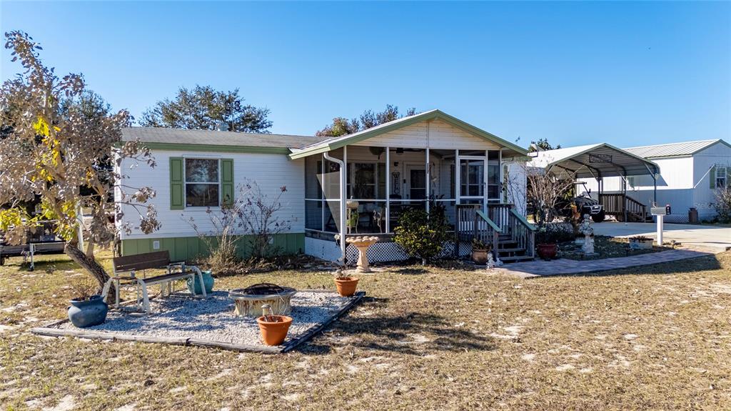 708 Fazzini Road Babson Park, FL 33827 - Photo 3 of 47 a front view of a house with patio