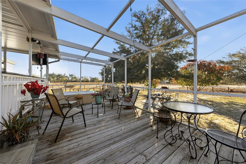 708 Fazzini Road Babson Park, FL 33827 - Photo 35 of 47 a view of a table and chairs in patio with wooden floor