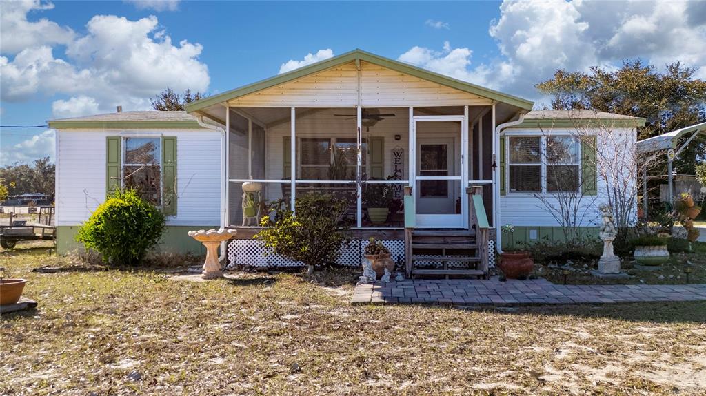 708 Fazzini Road Babson Park, FL 33827 - Photo 6 of 47 a front view of a house with garden