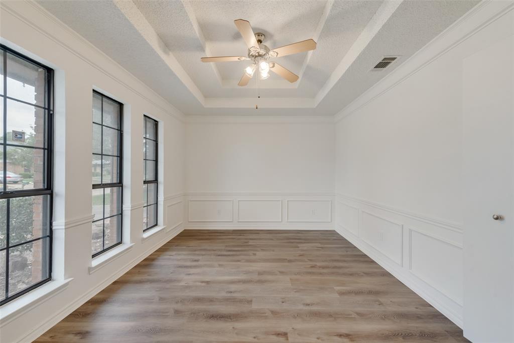 208 Timber Ridge Drive Murphy, TX 75094 - Photo 10 of 22 wooden floor in an empty room with a window