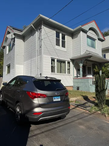 a house view with a sitting space and garden view