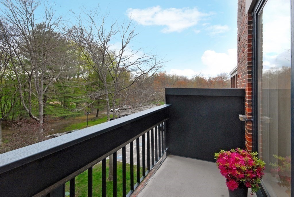 100 Keyes Road, Unit 307 Concord, MA 01742 - Photo 3 of 32 a view of a balcony with flower plants