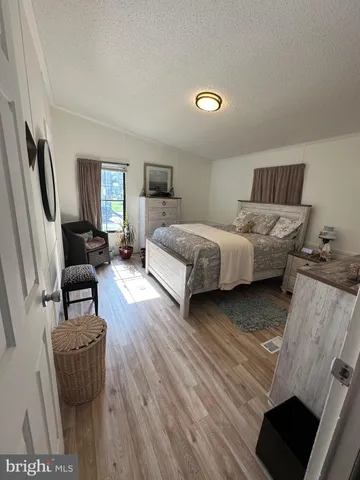 a spacious bedroom with a bed and a couch