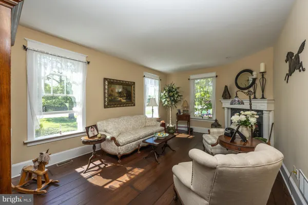 a kitchen with stainless steel appliances kitchen island granite countertop a dining table chairs and granite counter tops