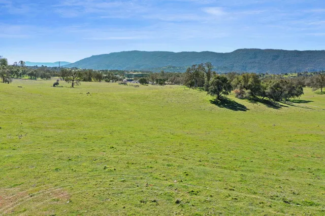 a view of an ocean with a mountain
