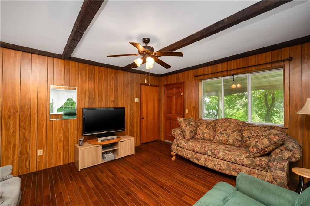 411 Harmony Road Baden, PA 15005 - Photo 6 of 25 a living room with furniture and a flat screen tv