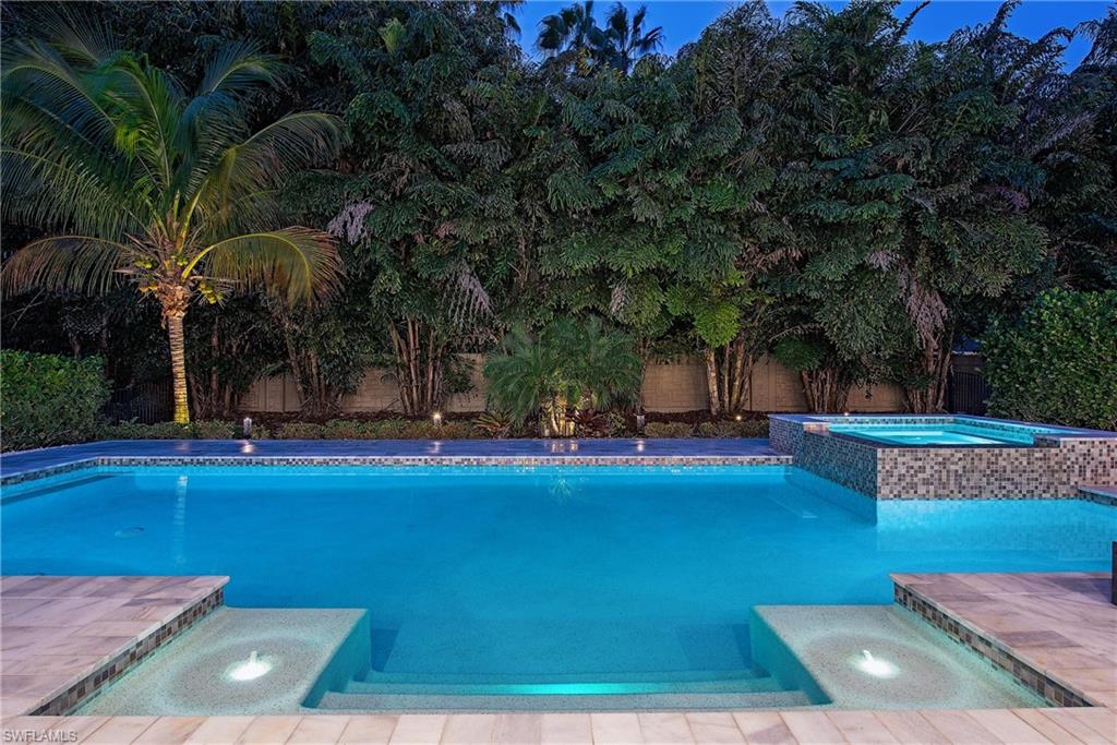 6830 Mangrove Avenue Naples, FL 34109 - Photo 25 of 28 a view of swimming pool with outdoor seating and trees