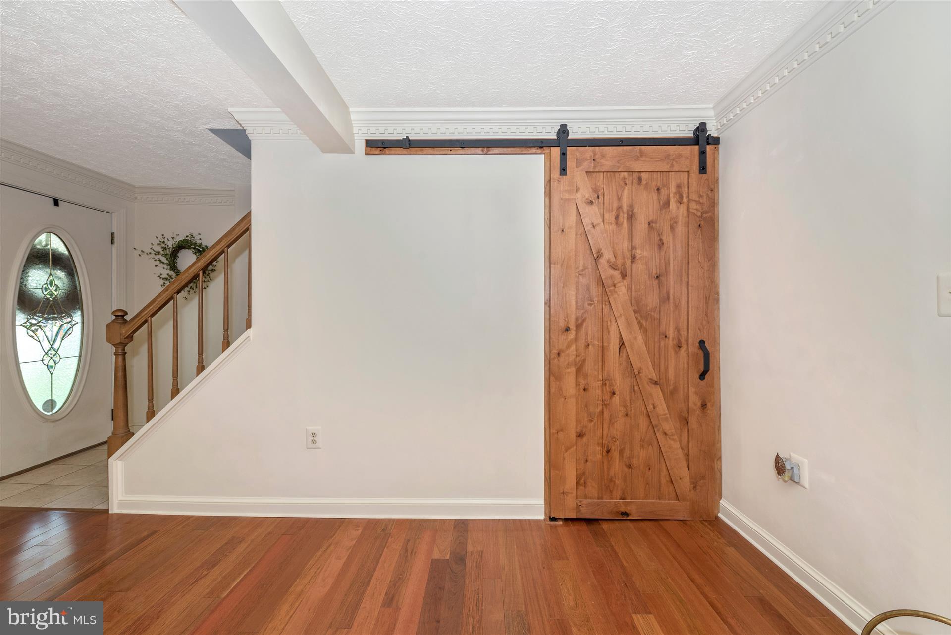 1210 Florence Road Mount Airy, MD 21771 - Photo 24 of 52 Barn Door Leading To First Floor Master Bedroom