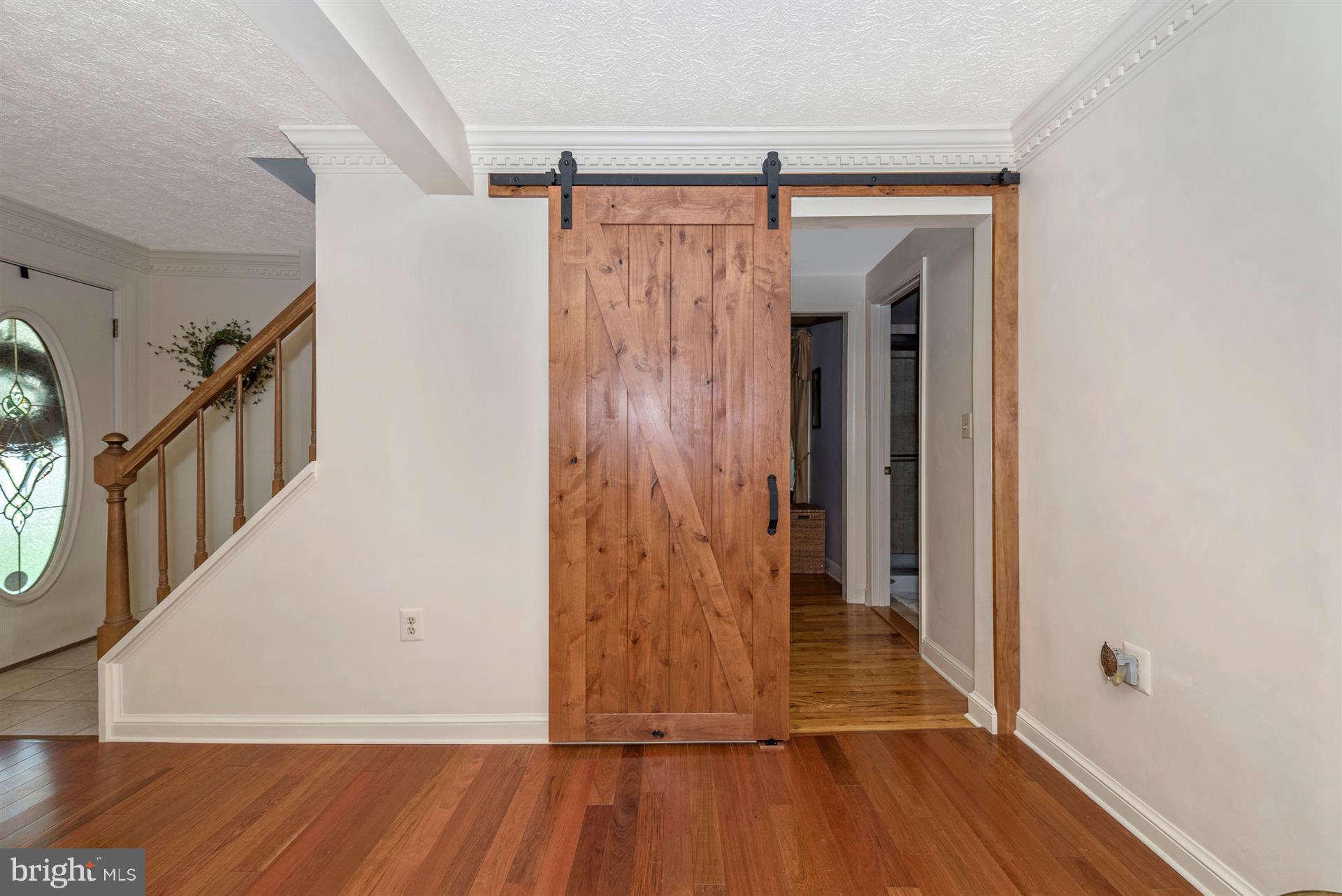 1210 Florence Road Mount Airy, MD 21771 - Photo 25 of 52 Barn Door Leading To First Floor Master Bedroom