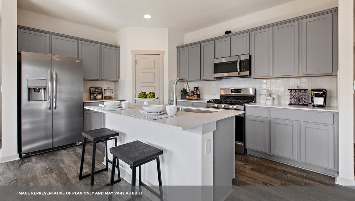 220 Century Plant Road Leander, TX 78641 - Photo 2 of 16 a kitchen with a sink stainless steel appliances and cabinets