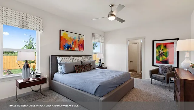 a bedroom with a bed and a couch