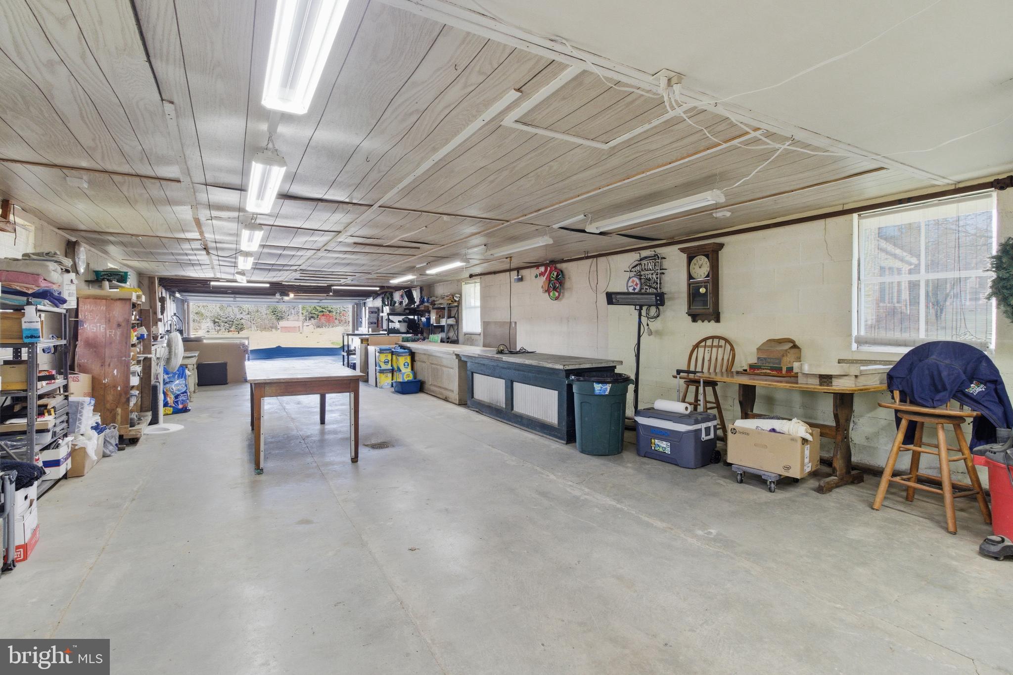 82 Ridge Street Smokerun, PA 16681 - Photo 16 of 52 a view of a garage with table and chairs