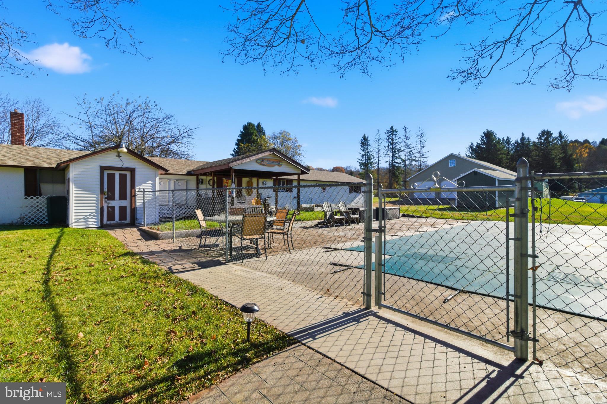 82 Ridge Street Smokerun, PA 16681 - Photo 23 of 52 a view of a house with swimming pool
