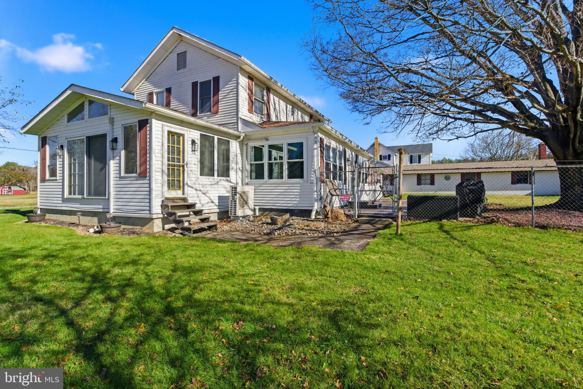 82 Ridge Street Smokerun, PA 16681 - Photo 27 of 52 a front view of a house with a yard table and chairs