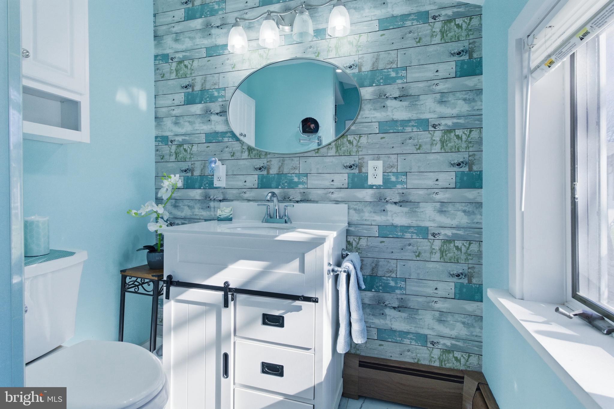 82 Ridge Street Smokerun, PA 16681 - Photo 29 of 52 a bathroom with a sink and a mirror