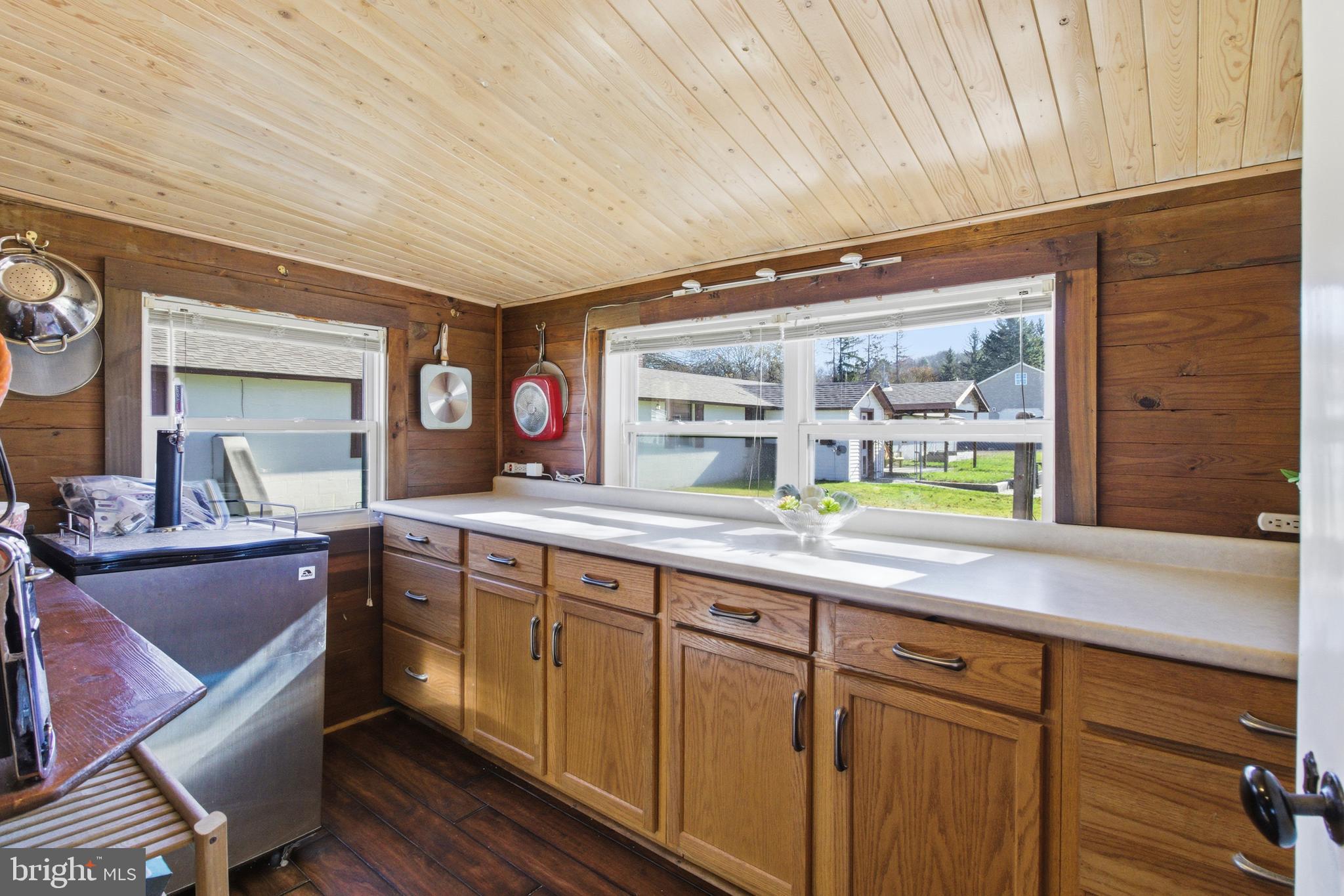 82 Ridge Street Smokerun, PA 16681 - Photo 32 of 52 a spacious bathroom with a granite countertop sink and a large mirror