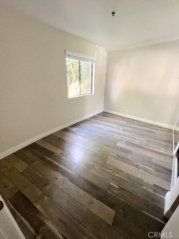 248 West Avenida Palizada, Unit 2 San Clemente, CA 92672 - Photo 12 of 21 an empty room with wooden floor cabinet and windows