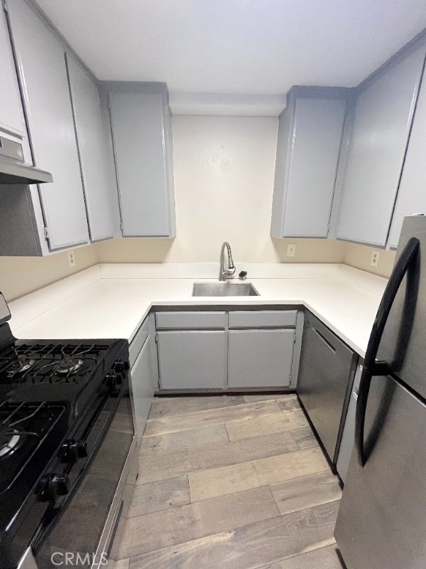 248 West Avenida Palizada, Unit 2 San Clemente, CA 92672 - Photo 9 of 21 a kitchen with a sink appliances and cabinets