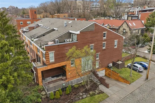 an aerial view of a house with a garden