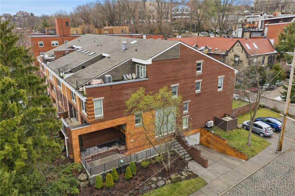 an aerial view of a house with a garden