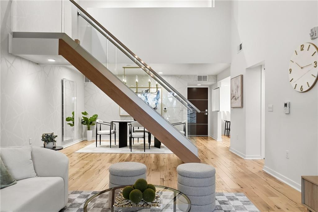 5742 Fifth Avenue, Unit 304 Pittsburgh, PA 15232 - Photo 12 of 32 a living room with furniture and a dining table
