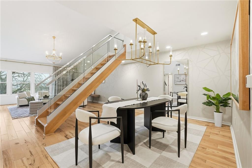5742 Fifth Avenue, Unit 304 Pittsburgh, PA 15232 - Photo 13 of 32 a view of a livingroom with furniture a table and chairs