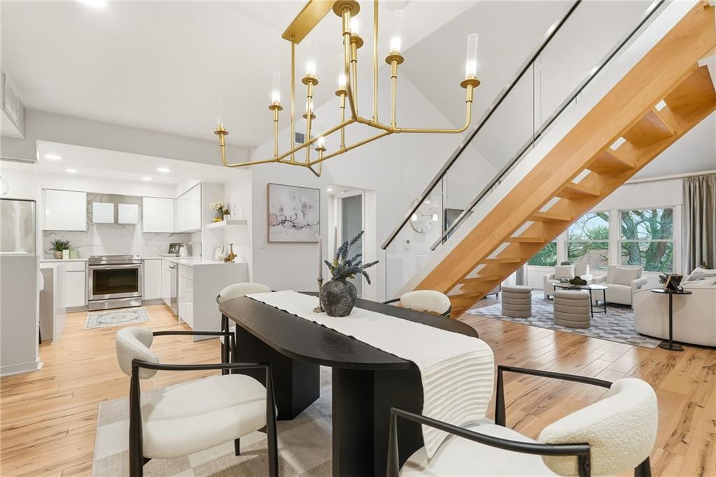 5742 Fifth Avenue, Unit 304 Pittsburgh, PA 15232 - Photo 14 of 32 a dining room with furniture entryway and wooden floor