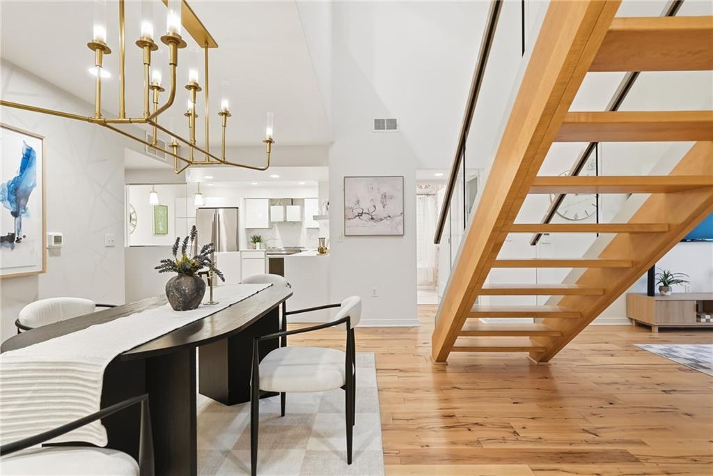 5742 Fifth Avenue, Unit 304 Pittsburgh, PA 15232 - Photo 16 of 32 a view of a dining room with furniture and wooden floor