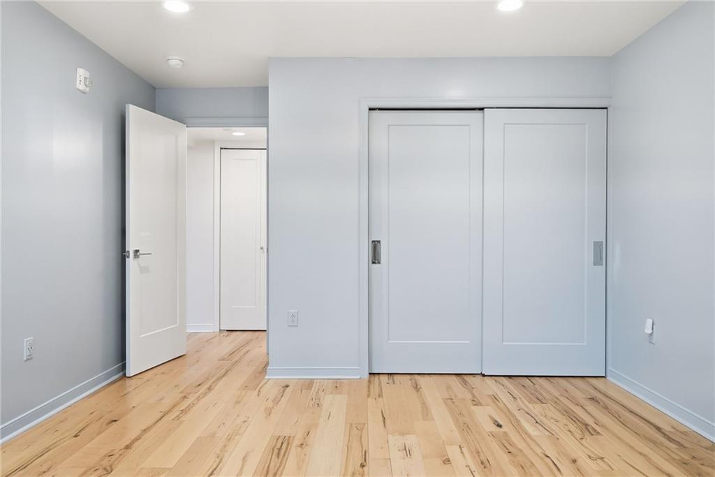 5742 Fifth Avenue, Unit 304 Pittsburgh, PA 15232 - Photo 27 of 32 a view of room with wooden floor