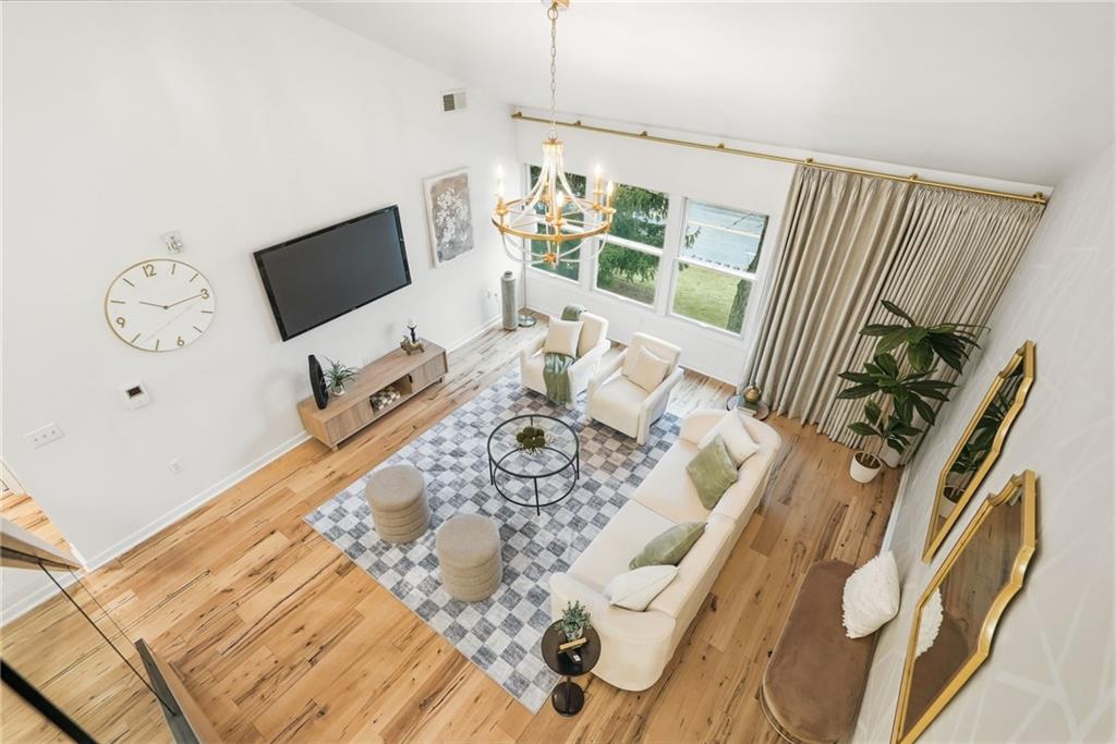 5742 Fifth Avenue, Unit 304 Pittsburgh, PA 15232 - Photo 29 of 32 a living room with furniture and a flat screen tv