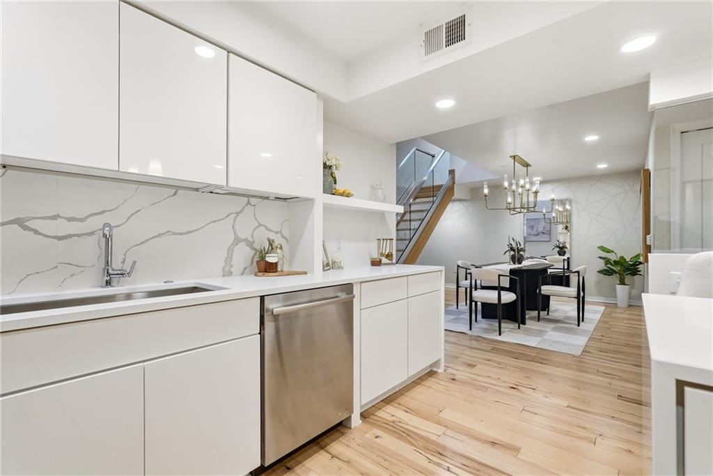 5742 Fifth Avenue, Unit 304 Pittsburgh, PA 15232 - Photo 7 of 32 a living room with furniture and wooden floor
