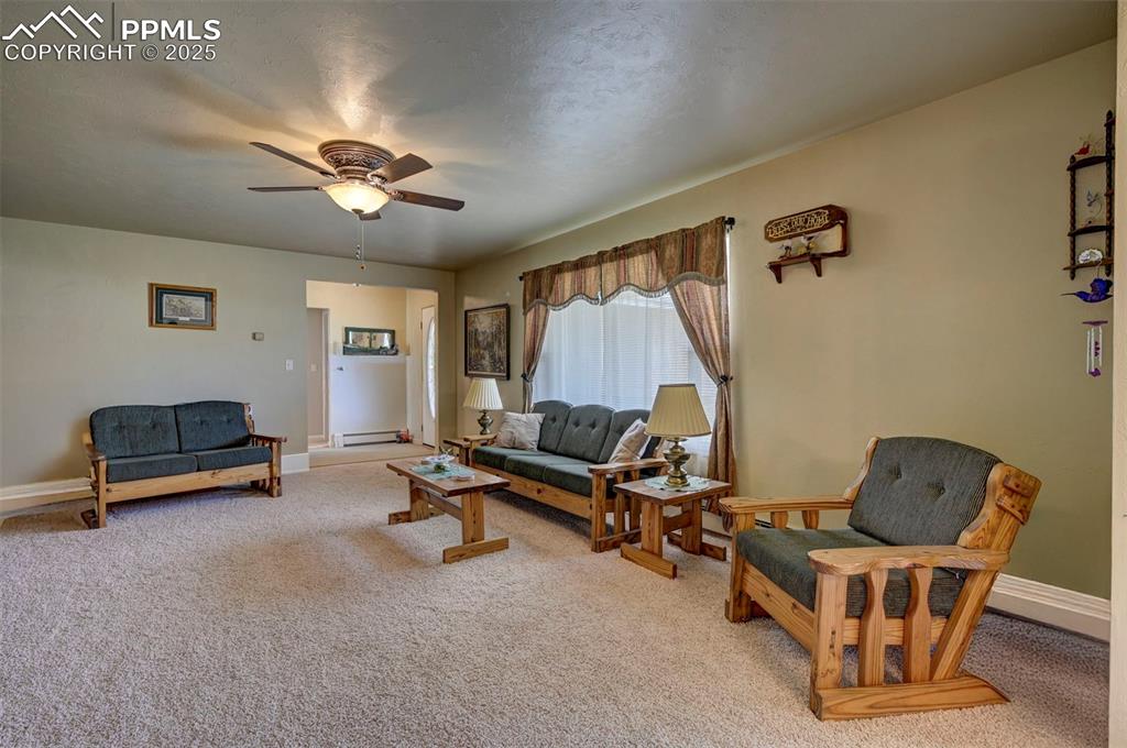 427 Ute Avenue Simla, CO 80835 - Photo 13 of 49 a living room with furniture a air conditioner vent and a window