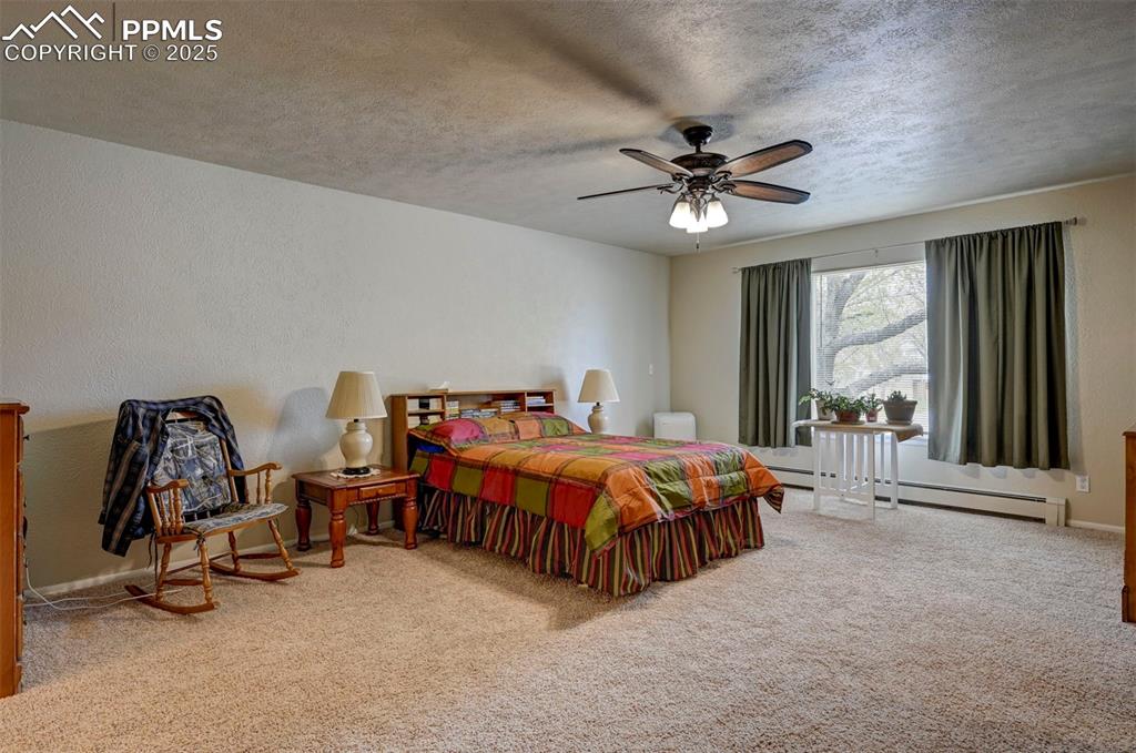 427 Ute Avenue Simla, CO 80835 - Photo 19 of 49 a bedroom with furniture and a large window