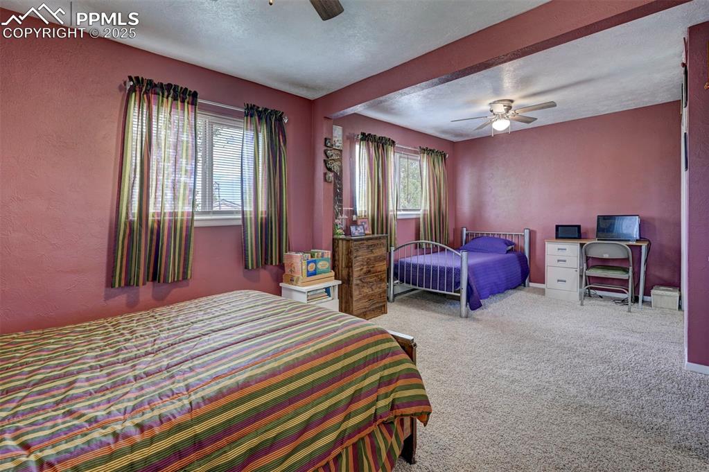 427 Ute Avenue Simla, CO 80835 - Photo 25 of 49 a bedroom with a bed and a chair