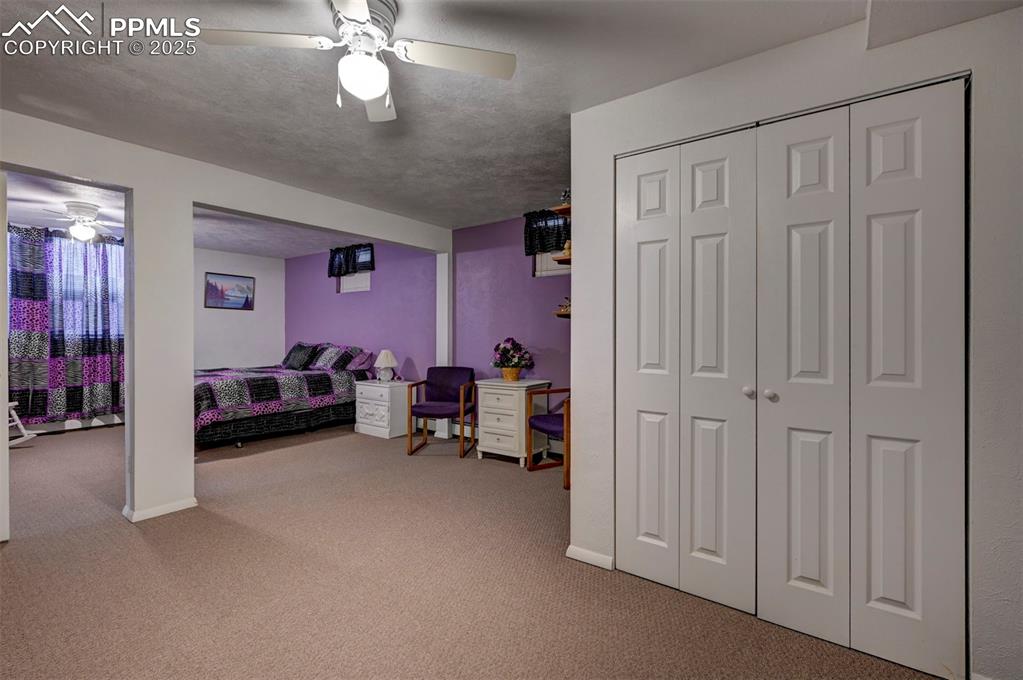 427 Ute Avenue Simla, CO 80835 - Photo 35 of 49 a view of a livingroom with furniture and a ceiling fan