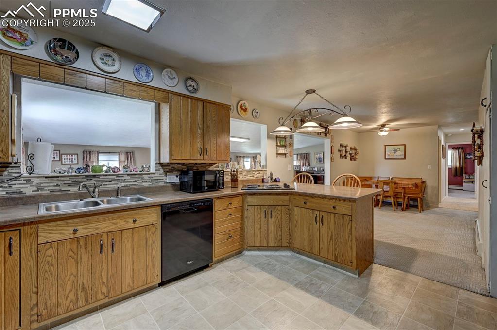 427 Ute Avenue Simla, CO 80835 - Photo 6 of 49 a large kitchen with cabinets and chairs