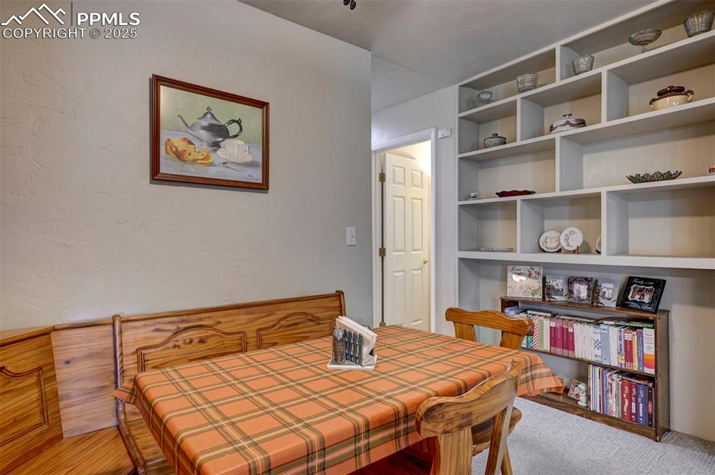 427 Ute Avenue Simla, CO 80835 - Photo 8 of 49 a bedroom with a bed and book shelf