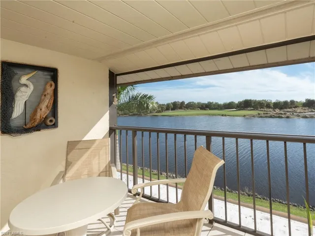 a view of a balcony with furniture