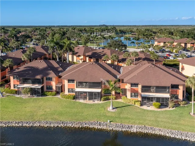 a aerial view of a house with a garden and yard