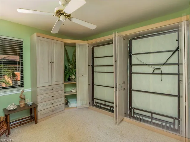 a view of an empty room with a fireplace