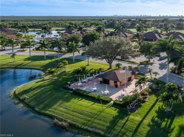 an aerial view of residential houses with outdoor space and swimming pool